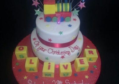 2 Tier multi Coloured Train and Star Cake